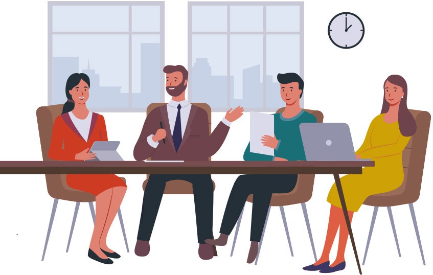 Four cartoon people sitting around an office desk talking.